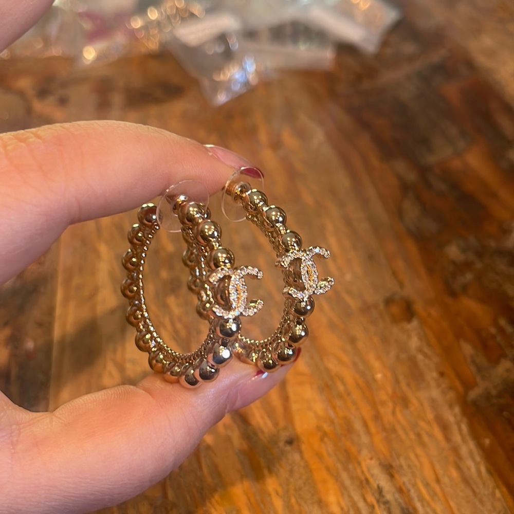 Gold hoop earrings with crystals
